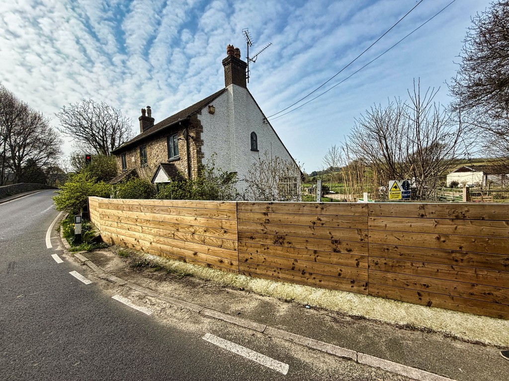 Lot: 144 - DETACHED COTTAGE WITH OUTBUILDING AND STABLES ON A SITE MEASURING OVER SIX ACRES - View of the cottage from rear